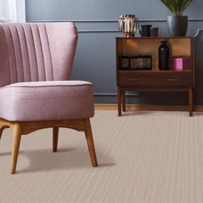 textured carpets in a stylish living room with pink chair